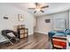Living room space featuring ceiling fan, hardwood floors, and comfortable furniture at 5426 Rainwood Meadows Dr, Apollo Beach, FL 33572