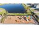 Community playground featuring slides, swings, and a climbing structure, offering a fun and safe area for children at 5426 Rainwood Meadows Dr, Apollo Beach, FL 33572