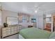 Cozy bedroom with carpet, ceiling fan and dresser at 5619 Bayshore Rd # 211, Palmetto, FL 34221