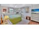Bright bedroom features a large window, carpet, and furniture at 5619 Bayshore Rd # 211, Palmetto, FL 34221