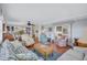 Open floor plan featuring a living room with wood floors and an adjacent dining area and kitchen at 5619 Bayshore Rd # 211, Palmetto, FL 34221