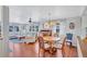 Inviting living room and dining area featuring a round table, ceiling fan, and comfortable seating arrangements at 5619 Bayshore Rd # 211, Palmetto, FL 34221