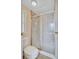 Enclosed shower with sliding glass doors and tile surround at 5619 Bayshore Rd # 211, Palmetto, FL 34221