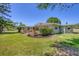 Expansive backyard with a deck area that offers tranquil waterfront views and a serene outdoor space at 5675 Saint Louis Ave, Sarasota, FL 34233