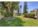 Lush backyard featuring mature trees and a peaceful waterfront setting, perfect for nature lovers at 5675 Saint Louis Ave, Sarasota, FL 34233