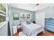 Relaxing bedroom with hardwood floors and a ceiling fan at 5675 Saint Louis Ave, Sarasota, FL 34233