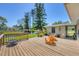 Relaxing backyard wooden deck offers tranquil water views with comfortable seating and landscaping at 5675 Saint Louis Ave, Sarasota, FL 34233