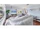 Open-concept living room with hardwood floors and comfortable seating at 5675 Saint Louis Ave, Sarasota, FL 34233