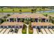 Stunning aerial view of the property with a beautiful golf course and lake in the backdrop at 5694 Palmer Cir # 202, Bradenton, FL 34211