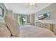 Bright bedroom with white bedding, a picturesque window view, and light tones for a peaceful ambiance at 5694 Palmer Cir # 202, Bradenton, FL 34211