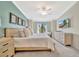 Bright bedroom features modern furnishings, neutral tones, and a beautiful view to create a cozy retreat at 5694 Palmer Cir # 202, Bradenton, FL 34211