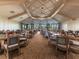 Bright dining area featuring beautifully arranged tables, floor to ceiling windows, and serene atmosphere at 5694 Palmer Cir # 202, Bradenton, FL 34211
