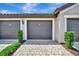 Spacious garage with lush landscaping at 5694 Palmer Cir # 202, Bradenton, FL 34211