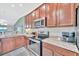Modern kitchen features stainless steel appliances, granite countertops, and white subway tile backsplash at 5694 Palmer Cir # 202, Bradenton, FL 34211