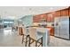 Bright kitchen boasts stainless steel appliances, granite counters, and a convenient breakfast bar at 5694 Palmer Cir # 202, Bradenton, FL 34211