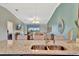 Open-concept kitchen with granite countertops, stainless steel sink, and views of the living area at 5694 Palmer Cir # 202, Bradenton, FL 34211