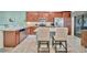 Spacious kitchen with stainless steel appliances, granite countertops, and a breakfast bar with seating at 5694 Palmer Cir # 202, Bradenton, FL 34211