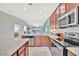Well-appointed kitchen features granite countertops, stainless steel appliances, and easy access to the living area at 5694 Palmer Cir # 202, Bradenton, FL 34211