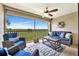Cozy screened lanai with stylish furniture and a picturesque view at 5694 Palmer Cir # 202, Bradenton, FL 34211