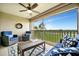 Inviting lanai with comfortable seating and scenic outdoor view at 5694 Palmer Cir # 202, Bradenton, FL 34211