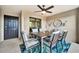 Covered lanai with dining table and stylish decor at 5694 Palmer Cir # 202, Bradenton, FL 34211