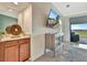 Stylish living area with a beverage center, decor and views of the golf course at 5694 Palmer Cir # 202, Bradenton, FL 34211