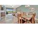 Bright living room with comfortable seating, golf course views and an adjacent dining area at 5694 Palmer Cir # 202, Bradenton, FL 34211