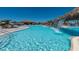 A beautiful rock waterfall feature flows into the luxurious community pool at 5694 Palmer Cir # 202, Bradenton, FL 34211
