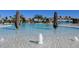A luxury community swimming pool with waterfall feature and water features at 5694 Palmer Cir # 202, Bradenton, FL 34211