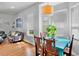 Cozy dining area featuring hardwood floors and large windows that flood the space with light at 6311 Sturbridge Ct, Sarasota, FL 34238