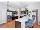 Contemporary kitchen with breakfast bar, stainless appliances, and hardwood flooring at 6311 Sturbridge Ct, Sarasota, FL 34238