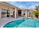 Backyard pool area with covered lanai, pool and water views at 6311 Sturbridge Ct, Sarasota, FL 34238