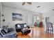 Comfortable living area boasts wood floors and a view into the adjacent dining space at 6311 Sturbridge Ct, Sarasota, FL 34238