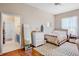 Comfortable bedroom with neutral colors and an ensuite bathroom at 6311 Sturbridge Ct, Sarasota, FL 34238