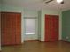 Bedroom features a ceiling fan, window and closet with sliding doors at 6339 Pontiac Ln, North Port, FL 34287
