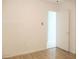 Bedroom featuring light walls and view into a brightly lit tiled room at 6339 Pontiac Ln, North Port, FL 34287