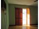 Bedroom features a closet with sliding doors and an air conditioner unit at 6339 Pontiac Ln, North Port, FL 34287