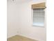 Neutral bedroom featuring hardwood floors and a window at 6339 Pontiac Ln, North Port, FL 34287