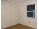 Bedroom featuring a closet, window, and wood floors at 6339 Pontiac Ln, North Port, FL 34287
