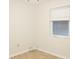 Neutral bedroom featuring hardwood floors and a window at 6339 Pontiac Ln, North Port, FL 34287