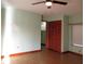 Bedroom features hardwood floors, a window and large closet with sliding doors at 6339 Pontiac Ln, North Port, FL 34287