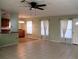 Spacious living room with tile floors, ceiling fan and breakfast bar at 6339 Pontiac Ln, North Port, FL 34287