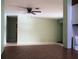 A spacious living area with ceiling fan and tile flooring at 6339 Pontiac Ln, North Port, FL 34287