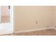 Neutral living room features tile floors and a doorway to another room at 6339 Pontiac Ln, North Port, FL 34287