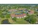 Breathtaking aerial view overlooking the condo buildings, verdant golf course, and serene lakes at 6501 Stone River Rd # 304, Bradenton, FL 34203