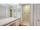 Well-lit bathroom with a spacious vanity, sink, and separate room for the toilet and shower stall at 6501 Stone River Rd # 304, Bradenton, FL 34203