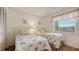 Cozy bedroom with two twin beds, closet, and a window offering a pleasant view at 6501 Stone River Rd # 304, Bradenton, FL 34203