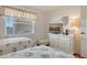 Bright bedroom with two twin beds and beach themed bedding, offering ample closet space at 6501 Stone River Rd # 304, Bradenton, FL 34203