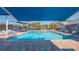 Beautiful community pool with ample seating under covered awnings for residents at 6501 Stone River Rd # 304, Bradenton, FL 34203
