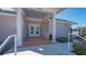 Community center entrance with tiled entryway and well-maintained landscaping at 6501 Stone River Rd # 304, Bradenton, FL 34203